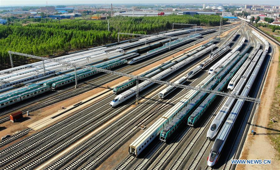 Aerial photo taken on May 10, 2018 shows rail vehicles produced by the CRRC Qingdao Sifang Co., Ltd. in Qingdao, a coastal city in east China\'s Shandong Province. Home to Tsingtao Beer and home appliance giant Haier, Qingdao is becoming a more attractive place to run important multilateral events. In June, the coastal city will host the 18th summit of the Shanghai Cooperation Organization (SCO). (Xinhua/Li Ziheng)
