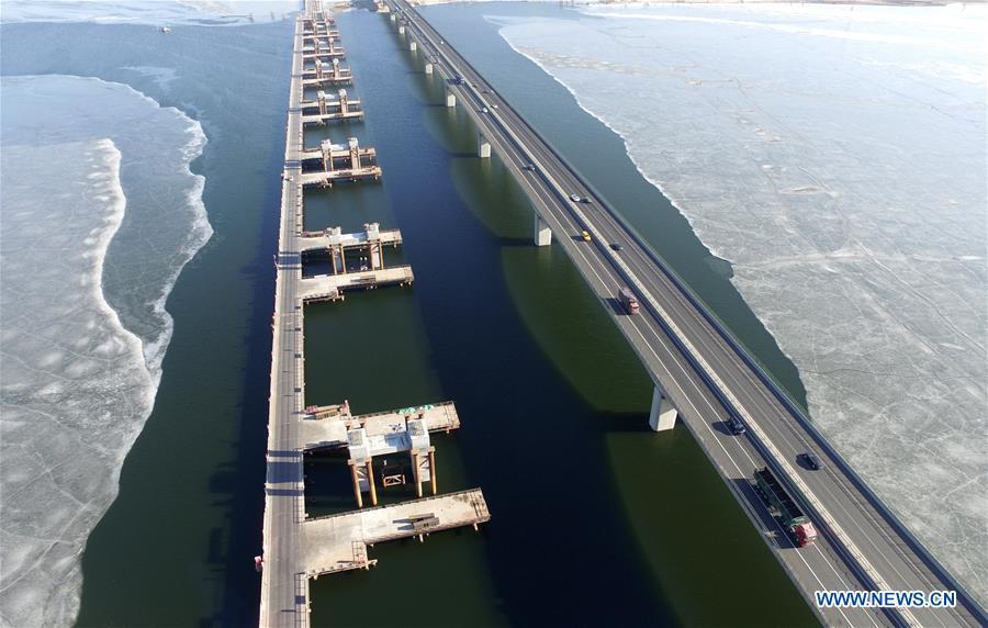 Aerial photo taken on Feb. 14, 2017 shows the under-construction bridge of the Jingzhang High-speed Railway across the Guanting Reservoir in Huailai County of Zhangjiakou City, north China\'s Hebei Province. The 18th Central Committee of the Communist Party of China (CPC) held the third plenary session in November, 2013. In the five years since then, China\'s reform momentum had been particularly strong as the CPC decided to advance reform in all aspects during the meeting. Since the third plenary session, Chinese President Xi Jinping has presided over at least 45 high-profile meetings on advancing reforms, during which 400 documents and 1,932 reform plans have been launched. As a result, China\'s reform has been expanded from the economic field to a broad sphere including administrative management, culture, society, ecological conservation, Party building, and the military. (Xinhua/Wu Diansen)